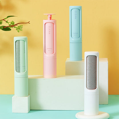Reusable pet hair roller with silicone roller head and grip handle, on a white background.