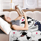 Dog resting on fleece blanket
